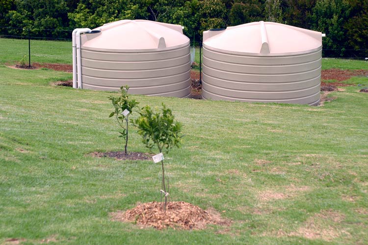 two 22700 litre round rainwater tank