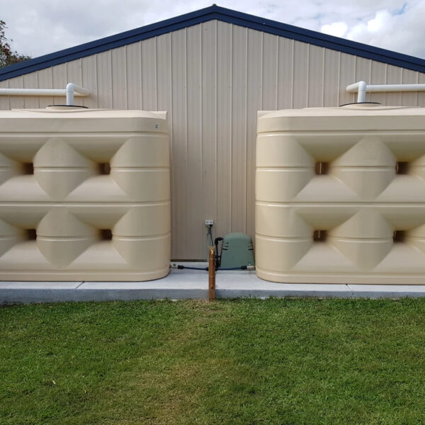 two slimline 4000 litre tanks smooth cream installed on shed